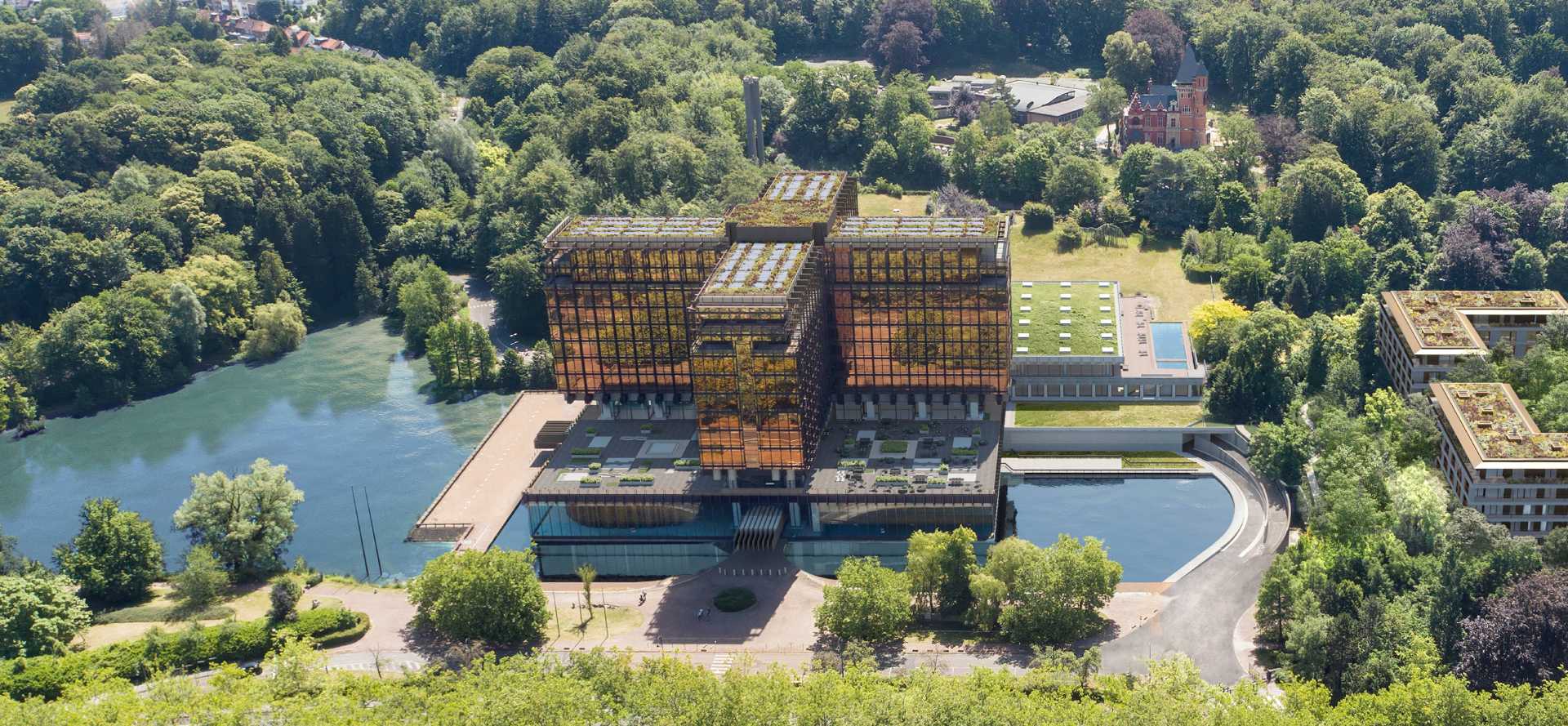 Vue aérienne du bâtiment du Mix, entouré d’eau et de verdure.